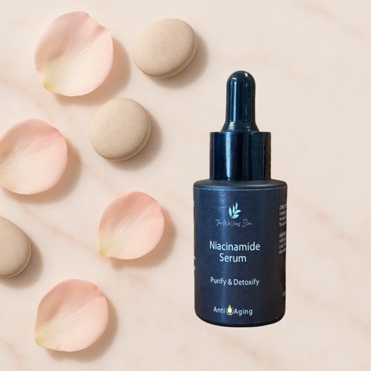 Niacinamide serum bottle with rose petals on a light pink background