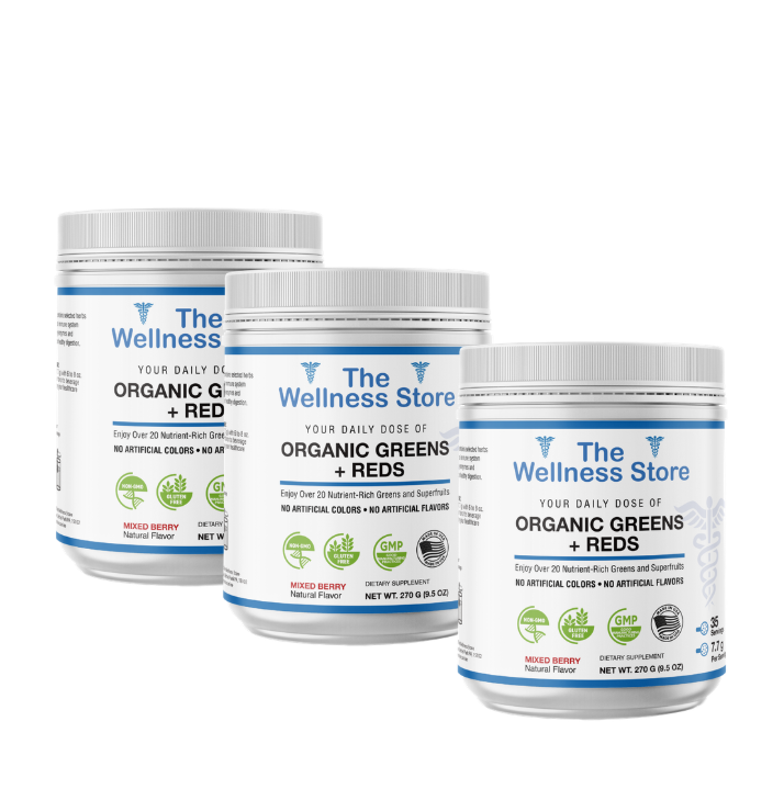 Three containers of 'The Wellness Store Organic Greens + Reds' on a white background