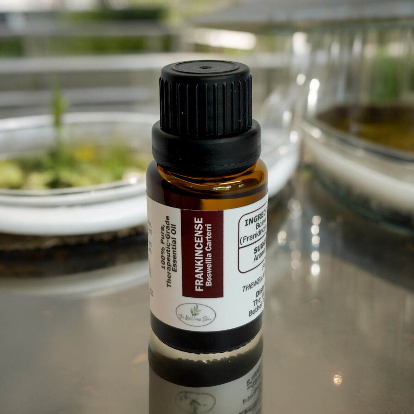 Frankincense Essential oil on table with a blurred background