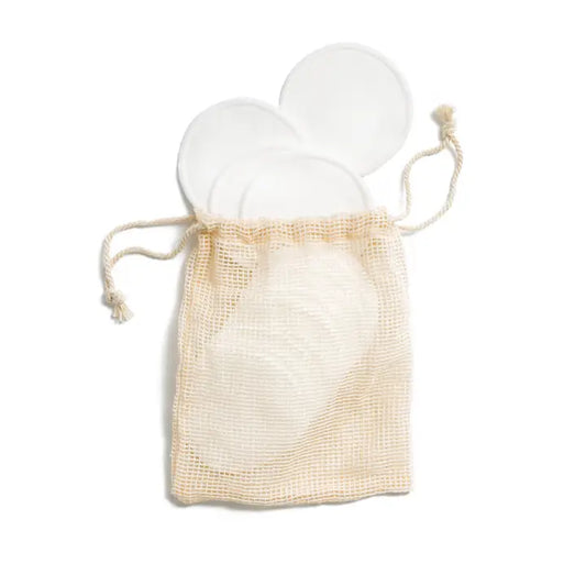 cotton pads in a drawstring bag on a white background