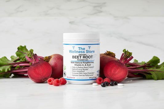 Organic Beet Root Powder Mix by The Wellness Store surrounded by fresh beets, raspberries, and blueberries on marble counter