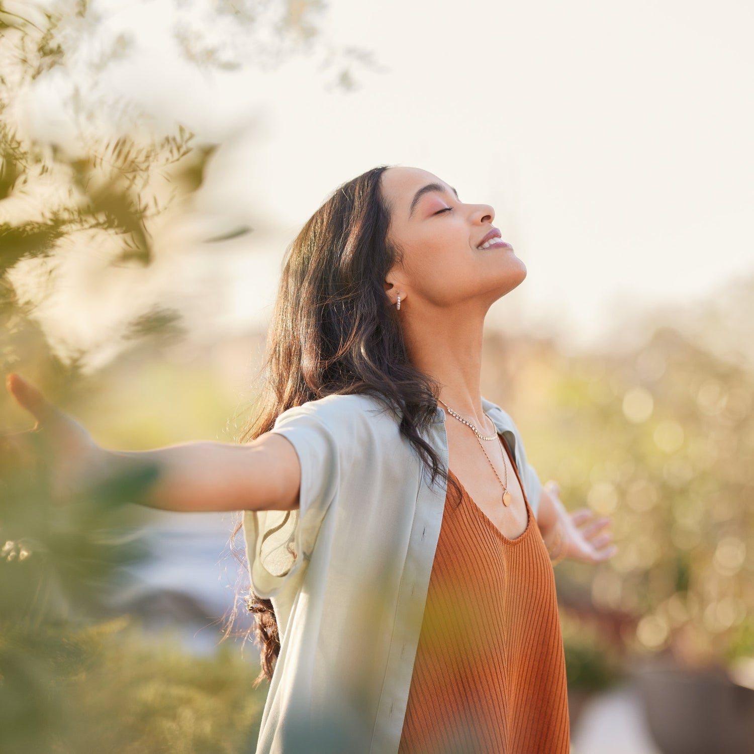 woman enjoying the outdoors in the fall smiling