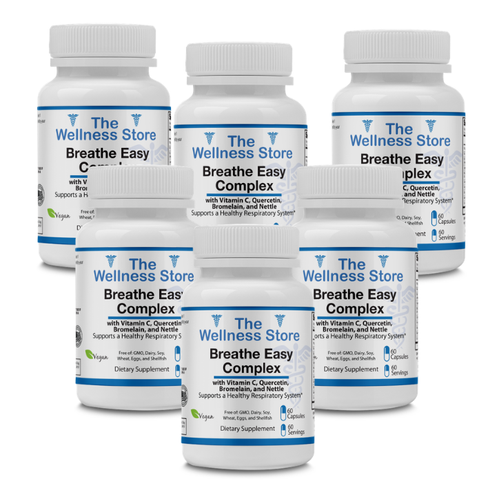 Six bottles of 'The Wellness Store Breathe Easy Complex' dietary supplements for allergy relief on a white background.
