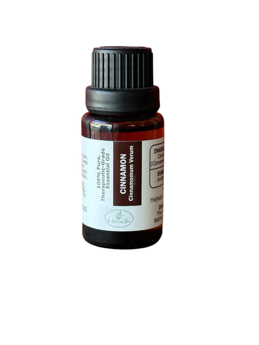 Cinnamon therapeutic‑grade essential oil bottle from The Wellness Store on a white background