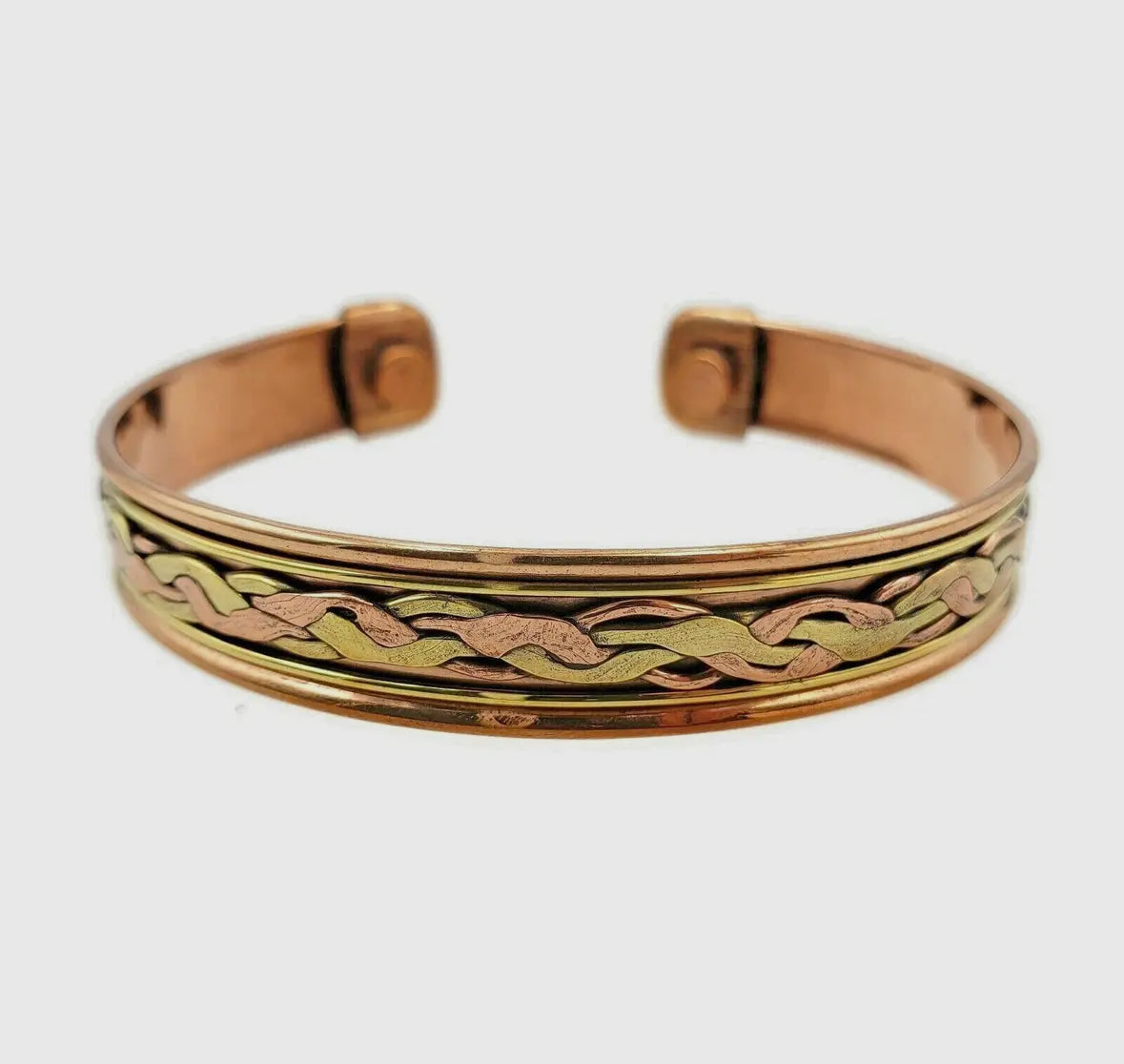 Gold and rose gold bangle with braided design on a white background