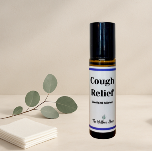 Cough relief essential oil rollerball with a branch of eucalyptus leaves on a beige background