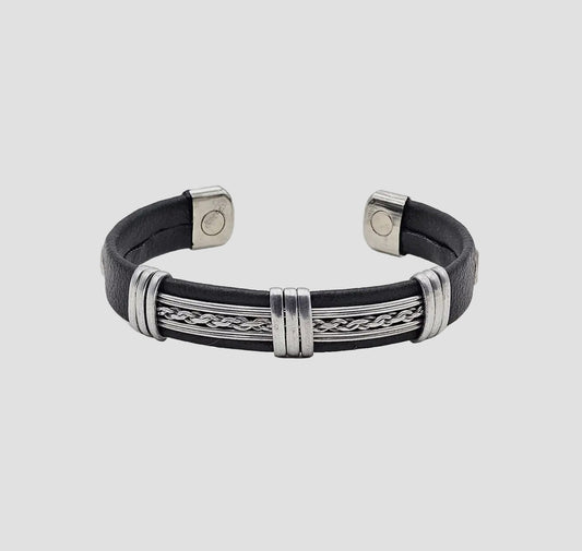 Black leather bracelet with silver metal accents on a light gray background
