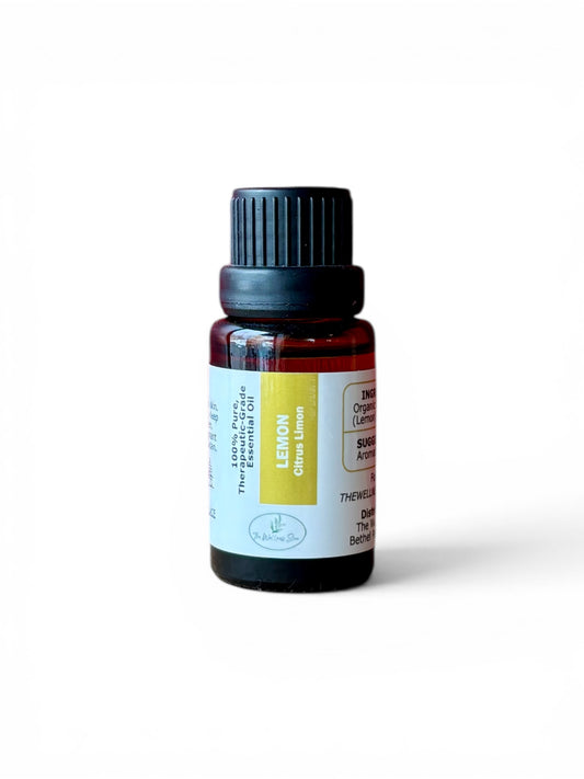 Lemon therapeutic‑grade essential oil bottle from The Wellness Store on a white background