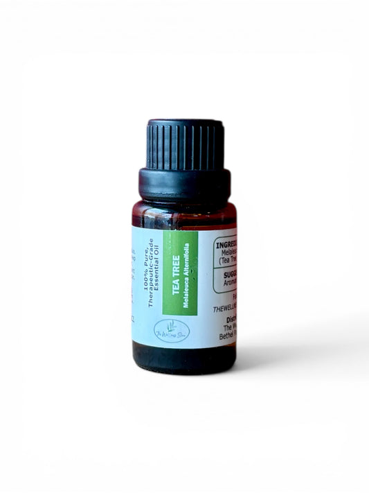 Tea Tree therapeutic‑grade essential oil bottle from The Wellness Store on a white background			
