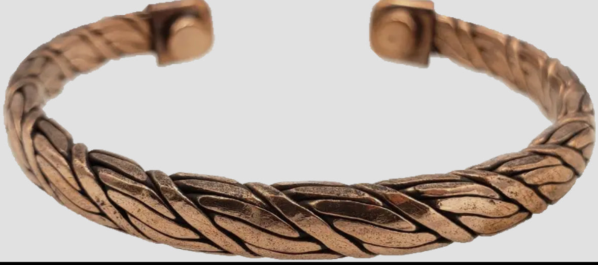 Bronze braided bracelet on a light gray background