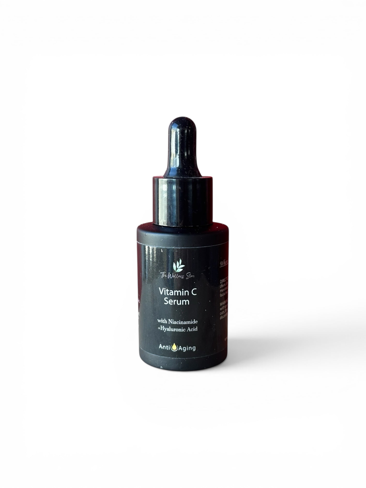 Vitamin C anti-aging serum bottle with dropper on a white background