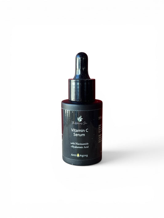 Vitamin C anti-aging serum bottle with dropper on a white background