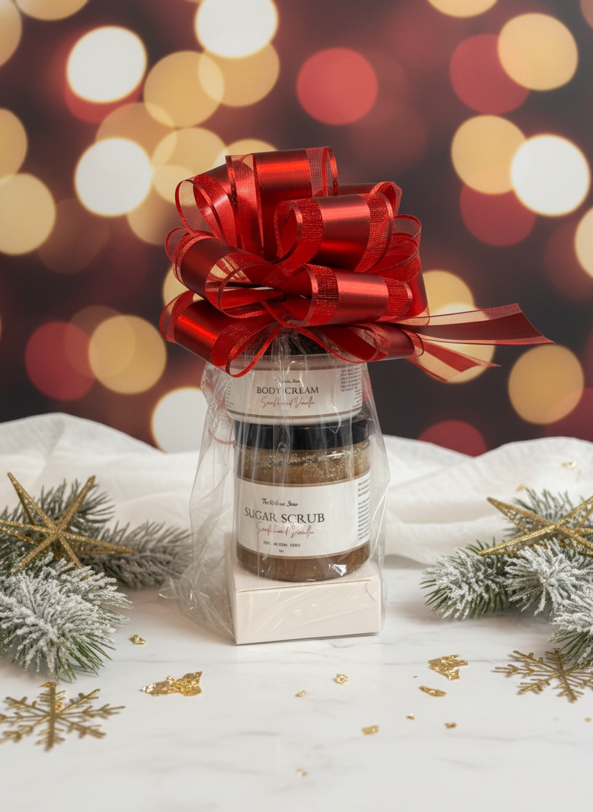 Gift set with Sandalwood Vanilla body cream. soap and scrub, wrapped in clear paper with a red bow, on a festive background.